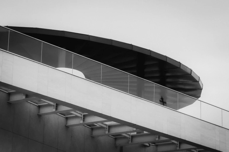 a building with a balconie on the roof next to it