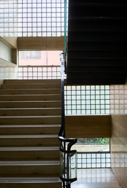 a stair case with railing and railing in front