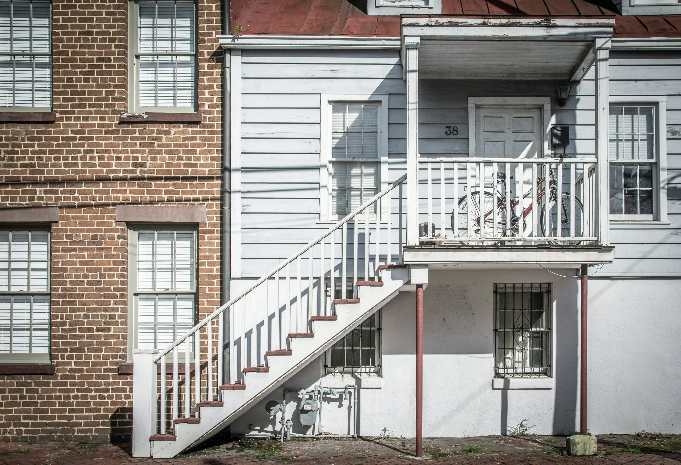 a set of steps and two buildings in the background