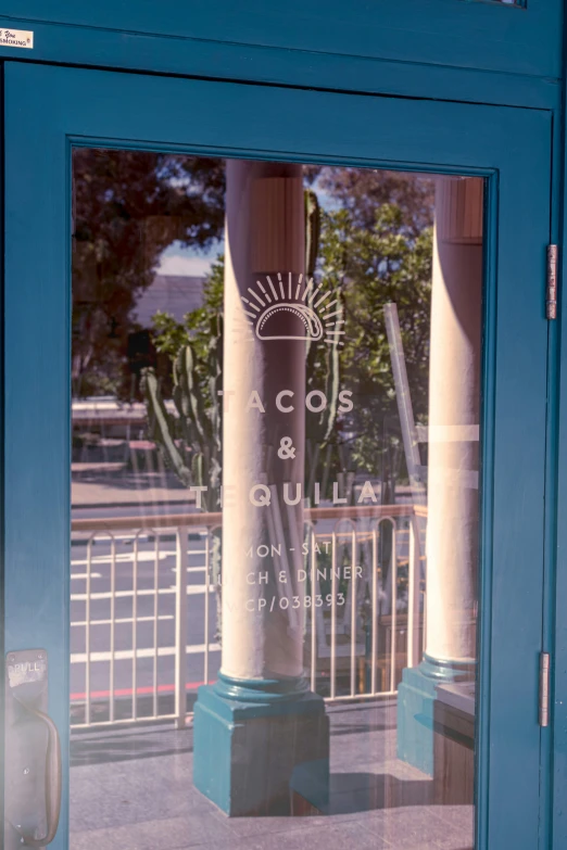 an old glass window of a restaurant with a sign