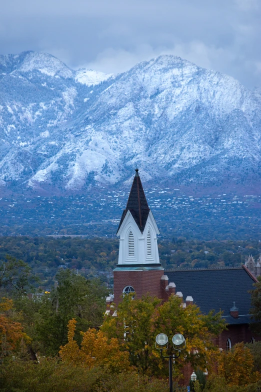 church in the background with mountain range in the distance