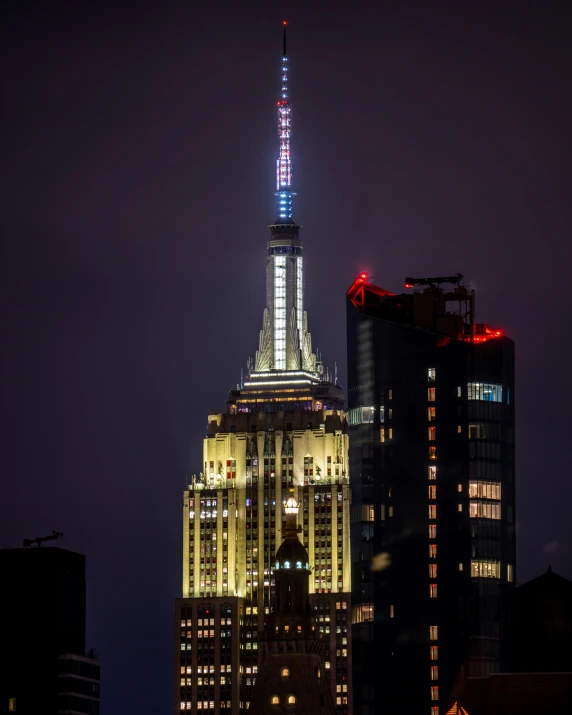 a night view of the empire building and surrounding skyscrs