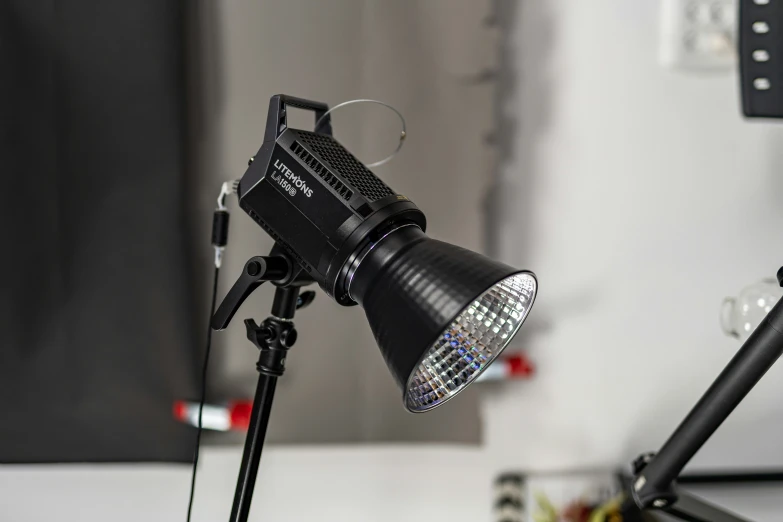 a black camera and its flash light