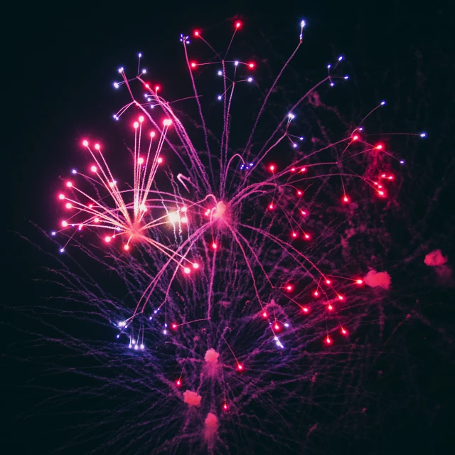 fireworks lit up and showing red, white, and blue lights