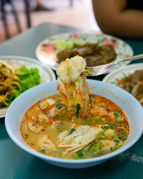 two plates filled with food sitting on a table