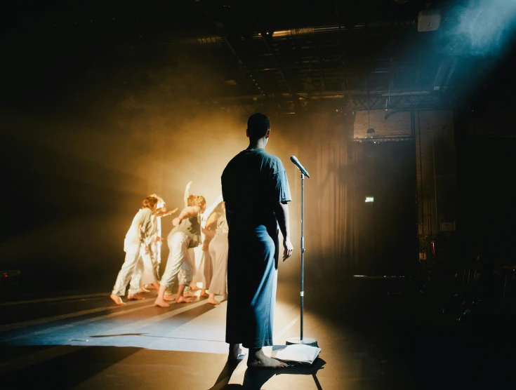 some people on a stage with a microphone