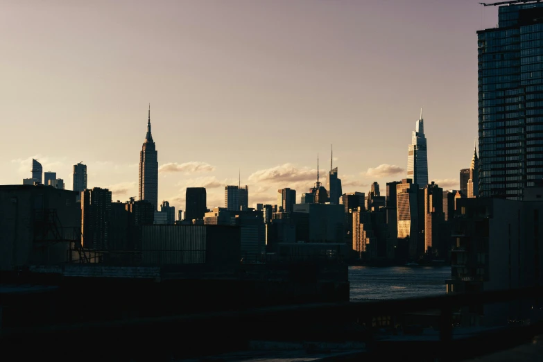 city skyline with an airplane flying over it