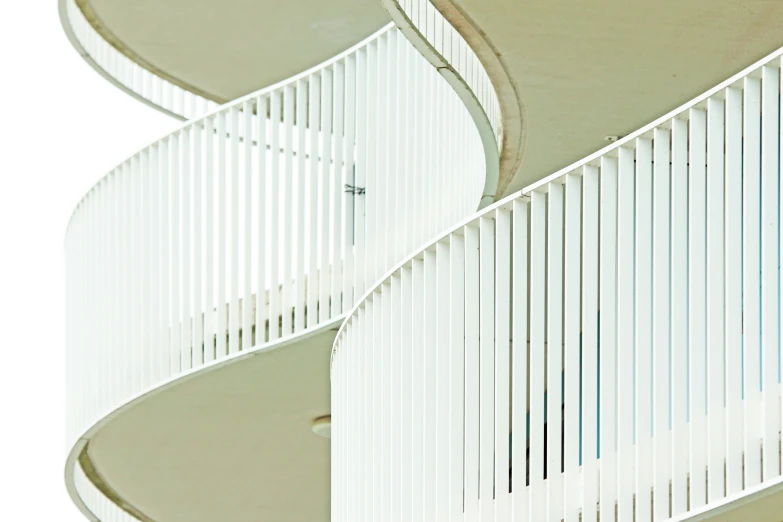 the side of a large white building with stairs