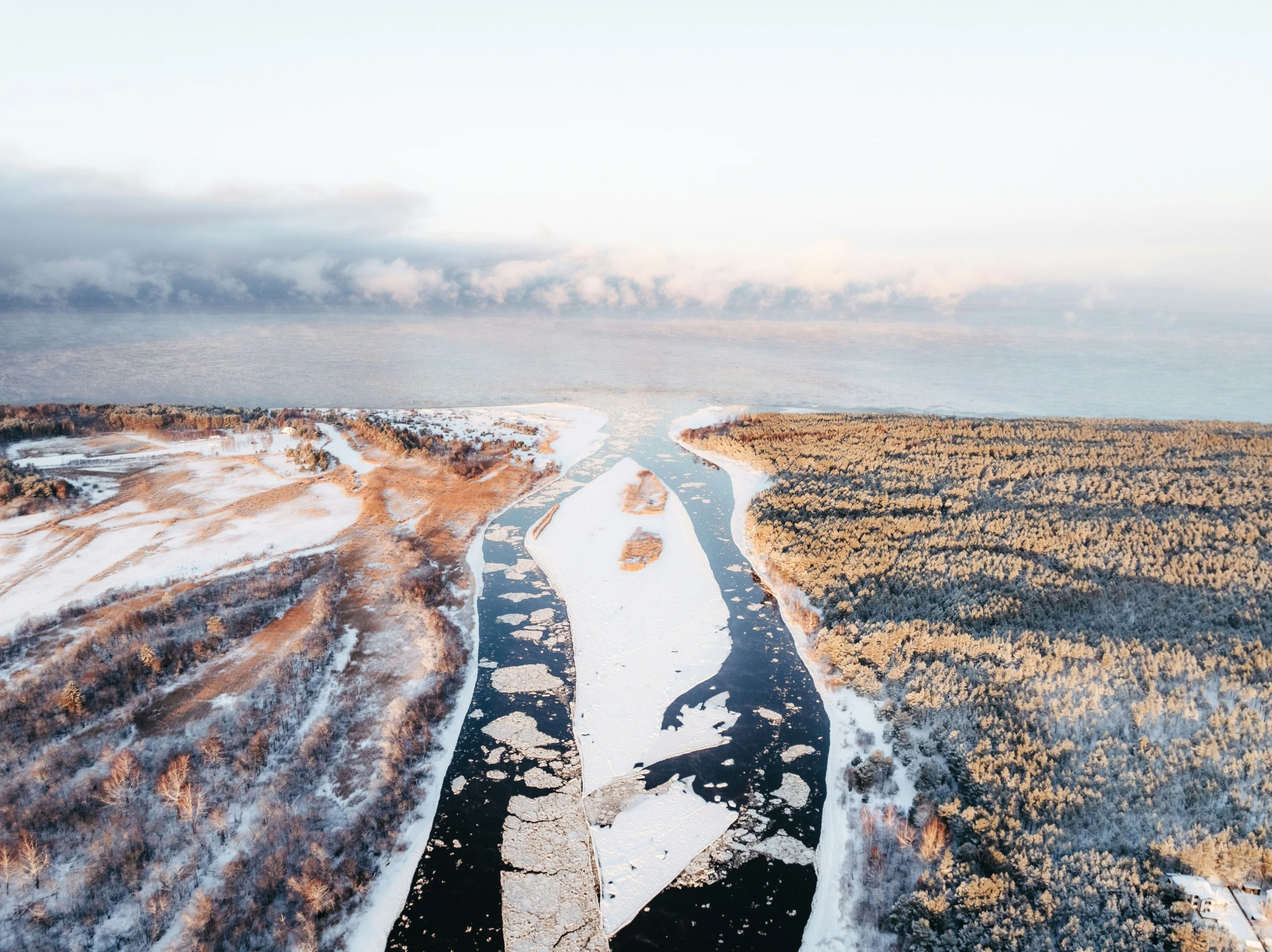 a po of an aerial s of snowy fields and mountains