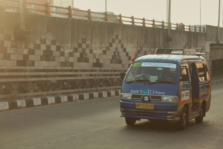 a van that is traveling on a road