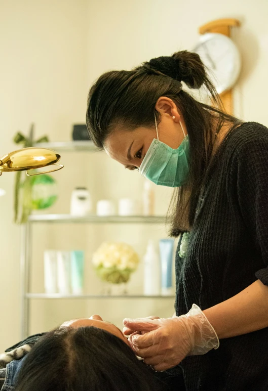 a woman getting facial wax at a facial care shop