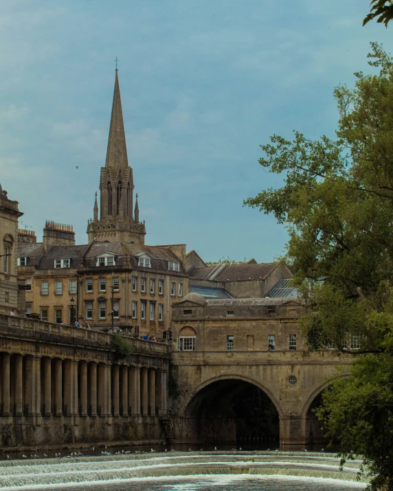 the clock tower is next to many buildings