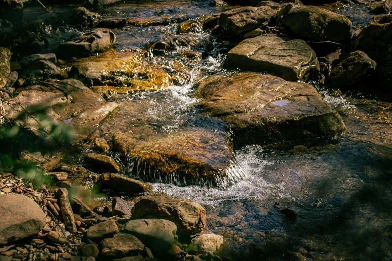 several rocks that are sitting in the water