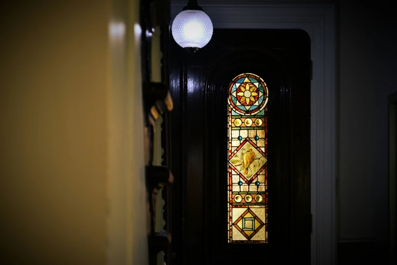a door leading to a stained glass door