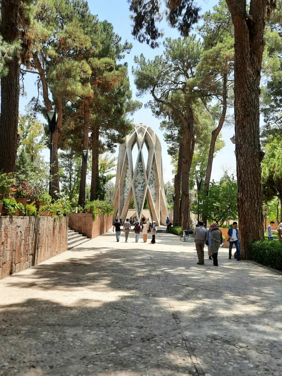 a walkway between two different bridges, surrounded by trees