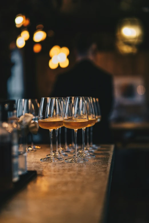 a row of glasses sitting on top of a counter