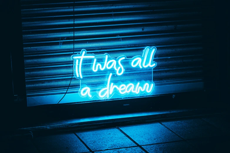 there is a neon sign that says it has all a dream