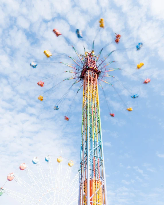 the ferris ride at an amut park is colorful