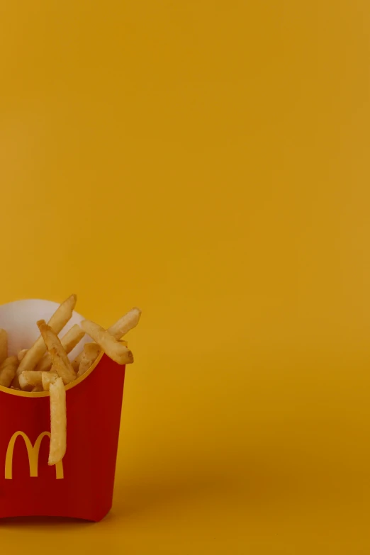 the french fries are in the bucket with kfc's written on it