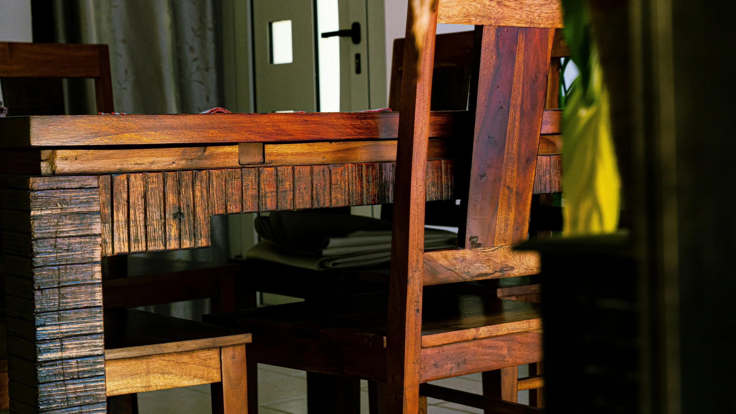 two wooden chairs sitting on top of a carpeted floor