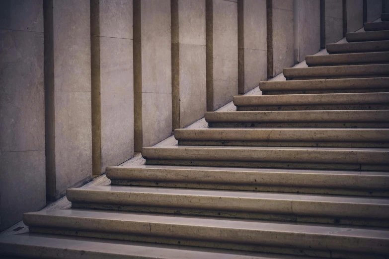 a cement stair with a concrete wall and stairs