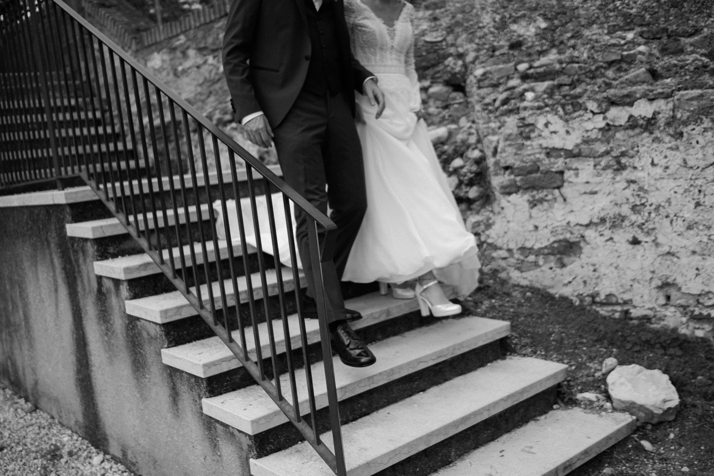 black and white pograph of a couple on a stairwell