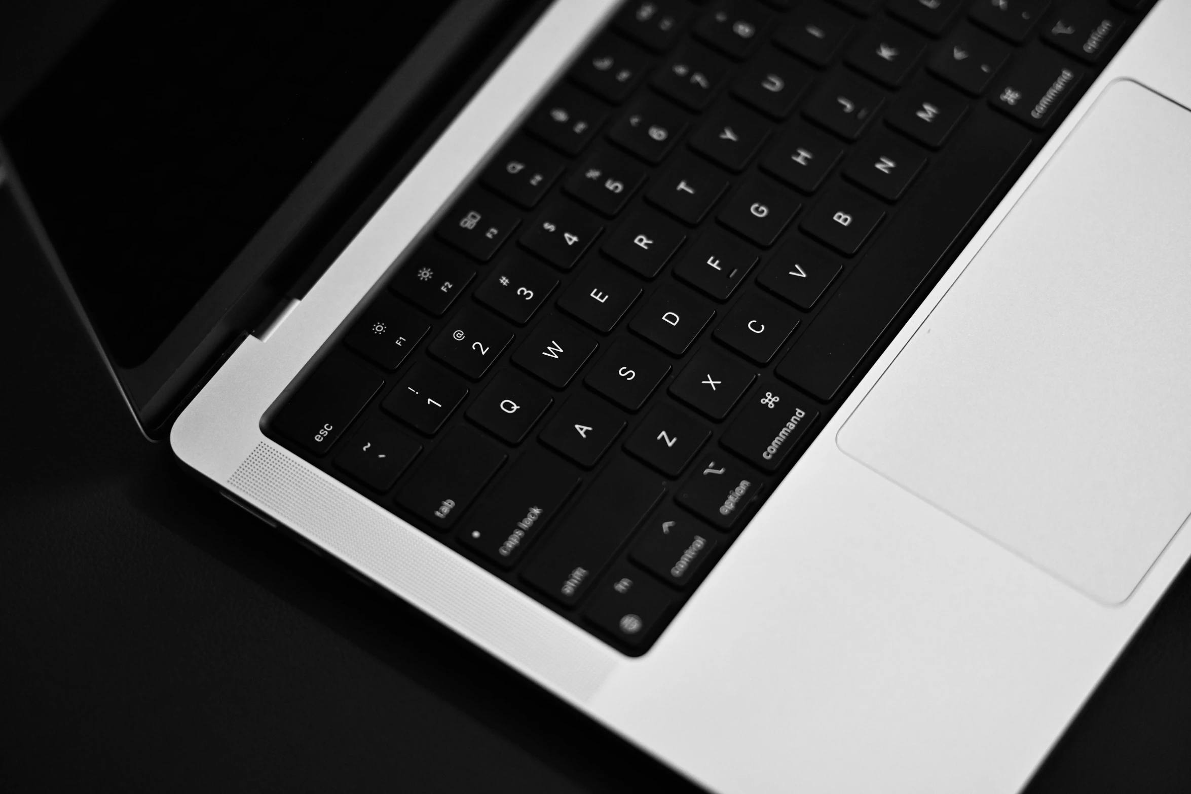 a black and white po of a laptop keyboard