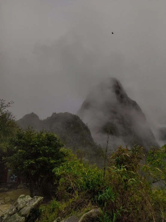 a mountain with lots of fog on it