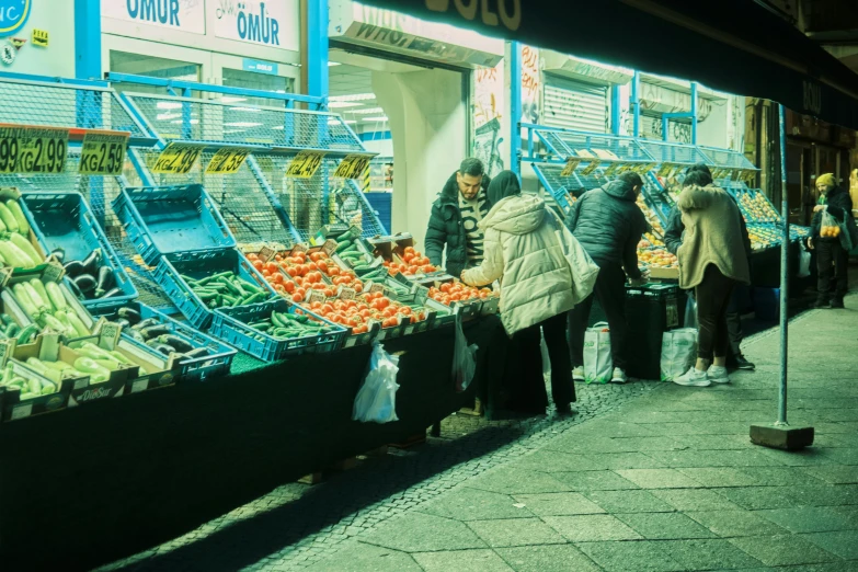 an outdoor produce market selling fruits and vegetables