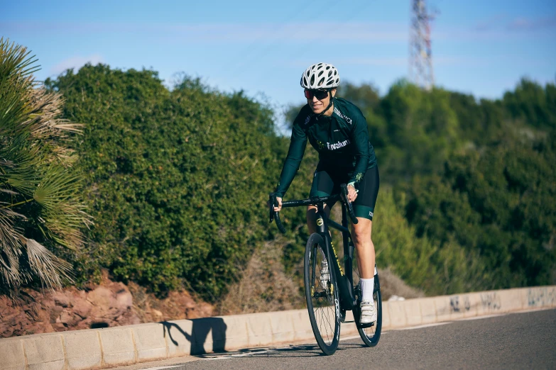 a person wearing a helmet riding a bike