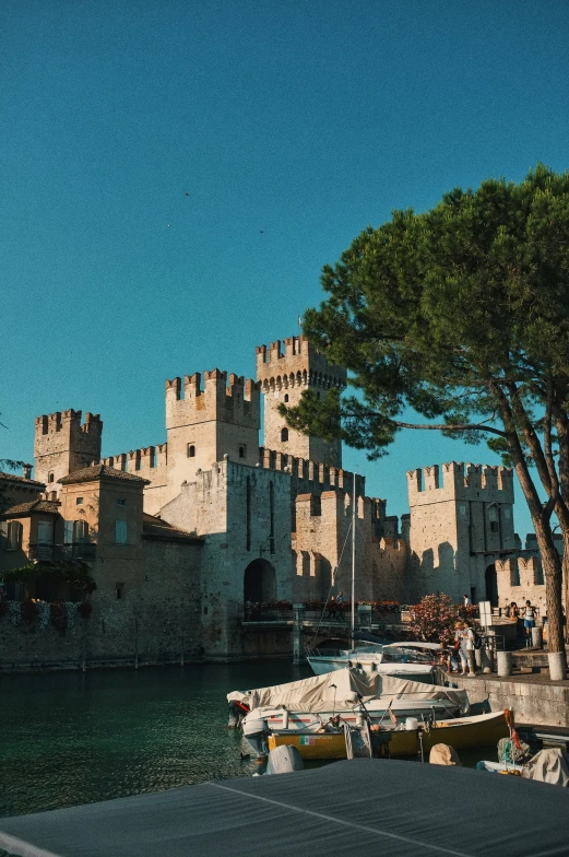 a castle on the edge of a river