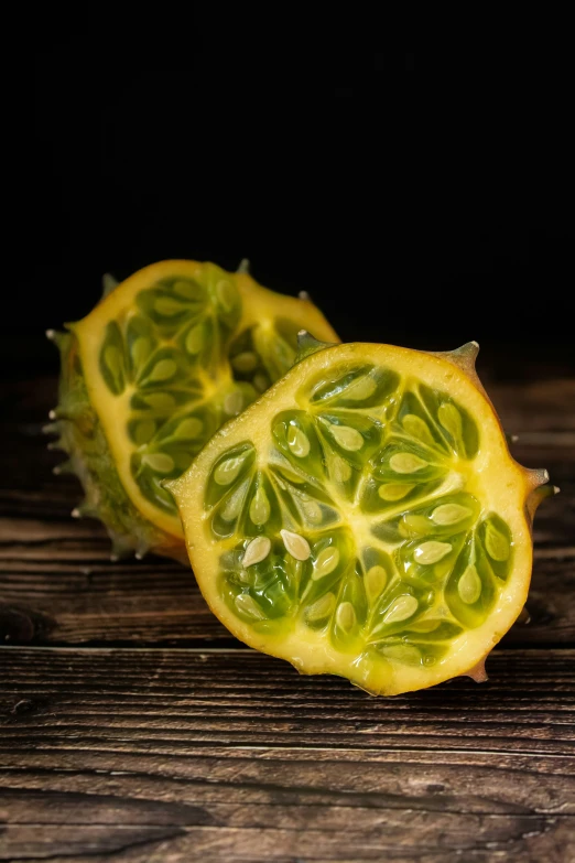 a sliced up lemon sitting on top of a wooden table