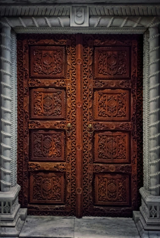 two big wooden doors sitting next to each other