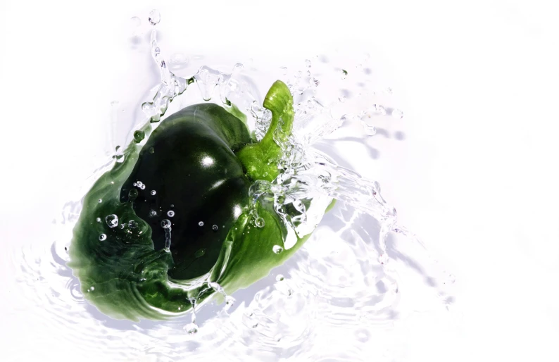 a green bell pepper in some water