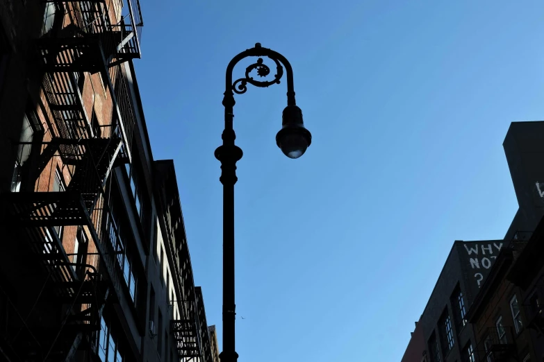 a street light and sign in a city