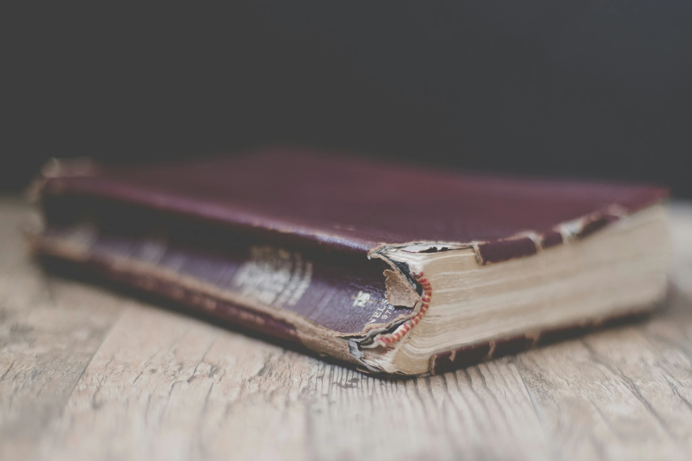 a close up of a very old, book