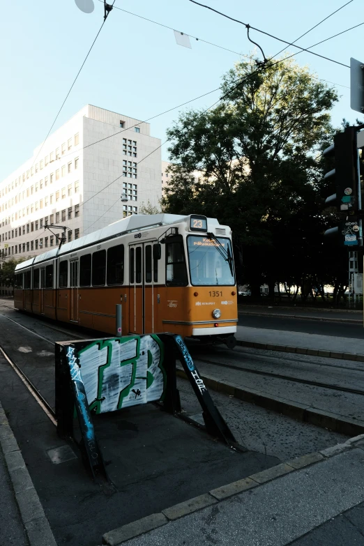 a light rail train traveling through an urban area