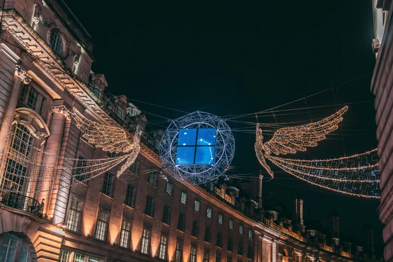 a large clock is on top of the building