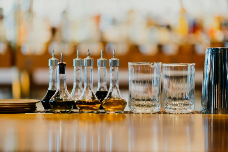 glasses are lined up near each other on the table