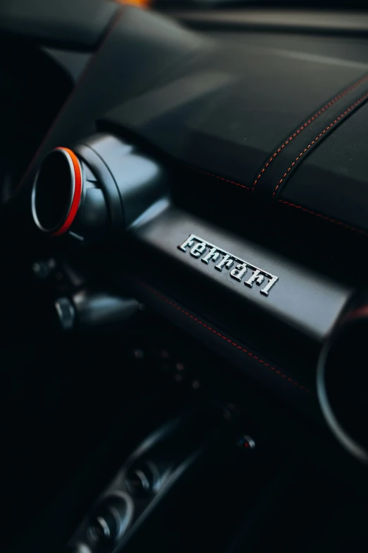 a close up view of the steering wheel of a sports car