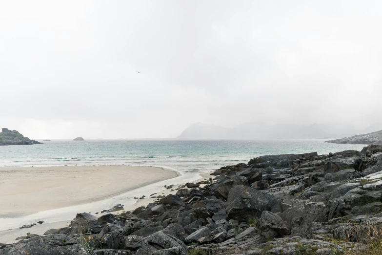 a very close up of a rocky beach near the ocean