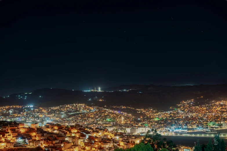 a city that is on a hill in the night