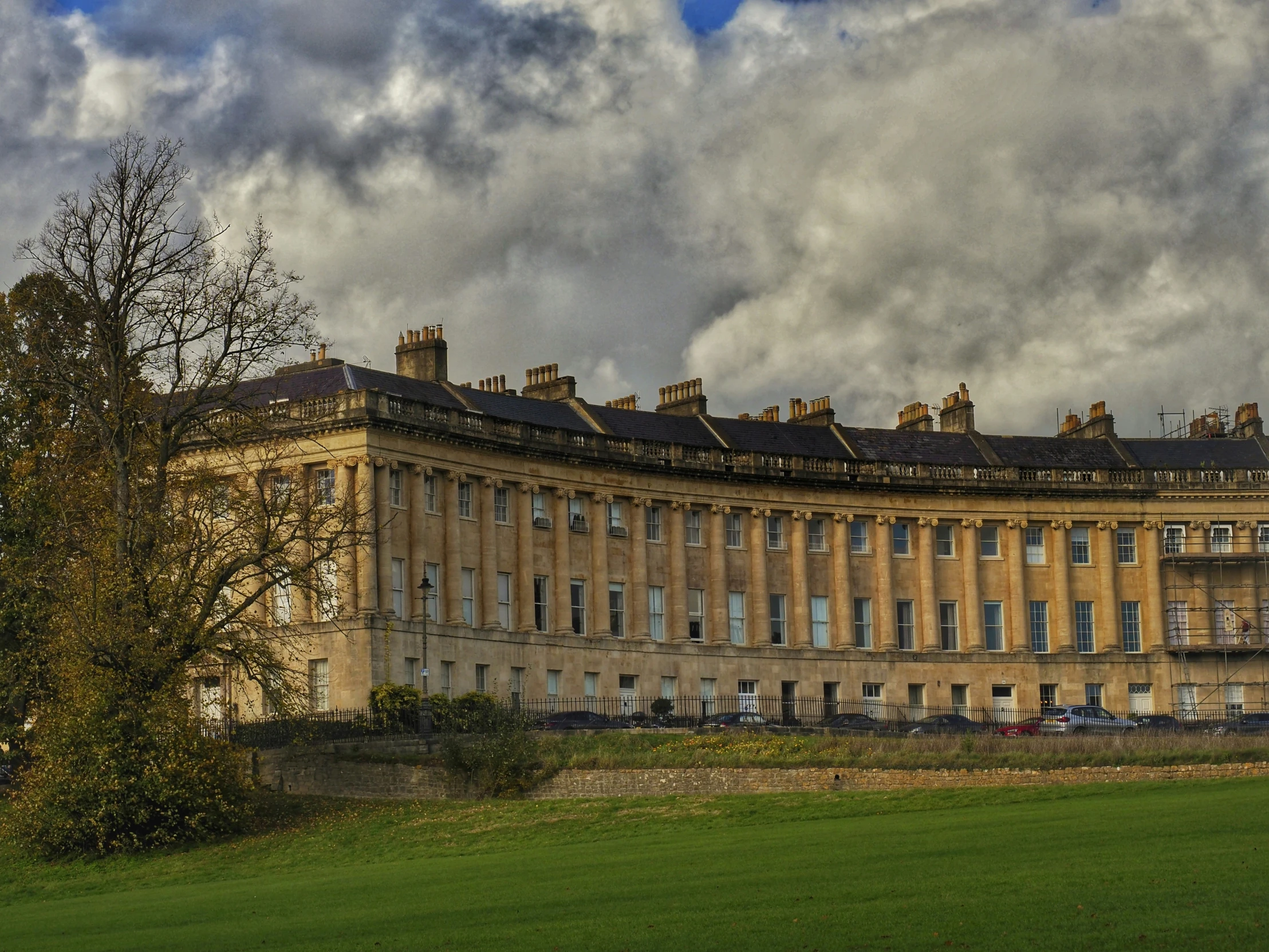 a building with several stories and a cloudy sky