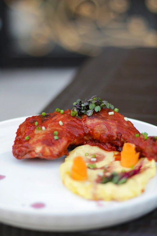 a dish is served on a plate with vegetables