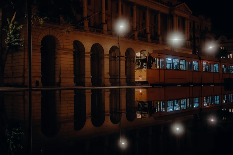 a bus on its side in front of a building