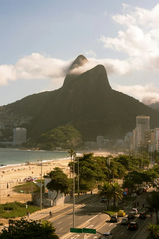 a big city next to the ocean and mountains