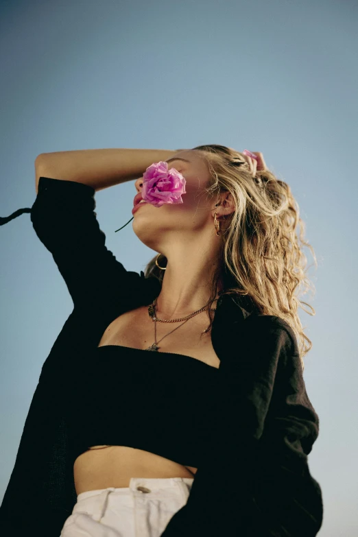 a girl with flowers in her hair is posing