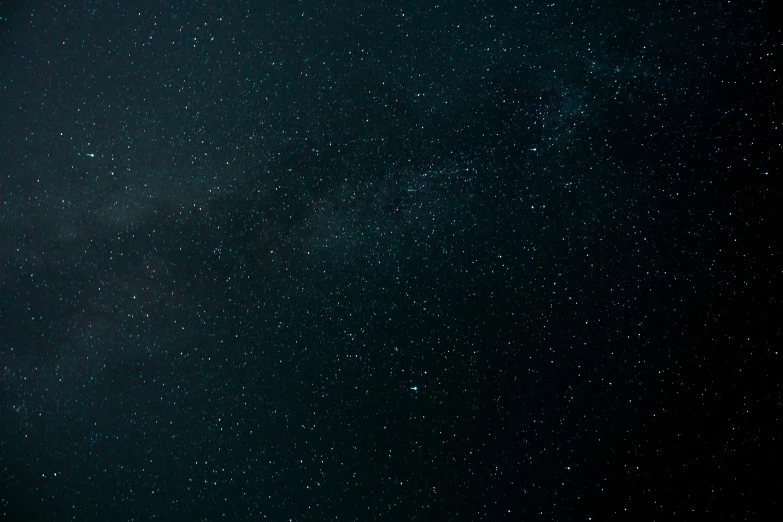 an airplane is flying above the ground in night