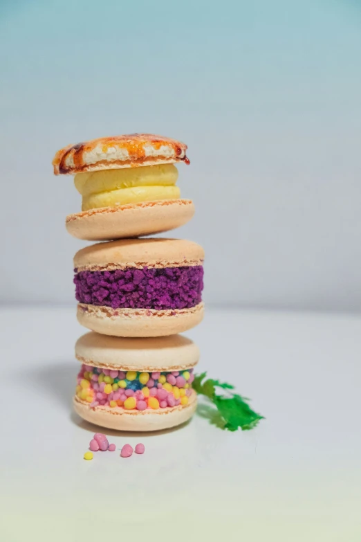 a stack of colorful macaroni sandwiches with chocolate, macaroni and cheese