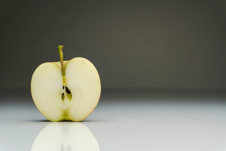 a half eaten apple sitting on top of a counter